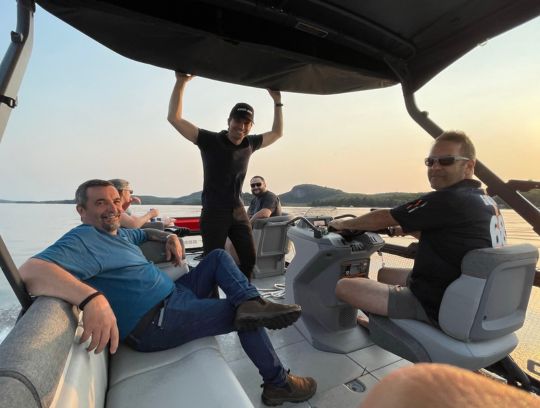 TIBO team on boat at annual employee summer party of 2022